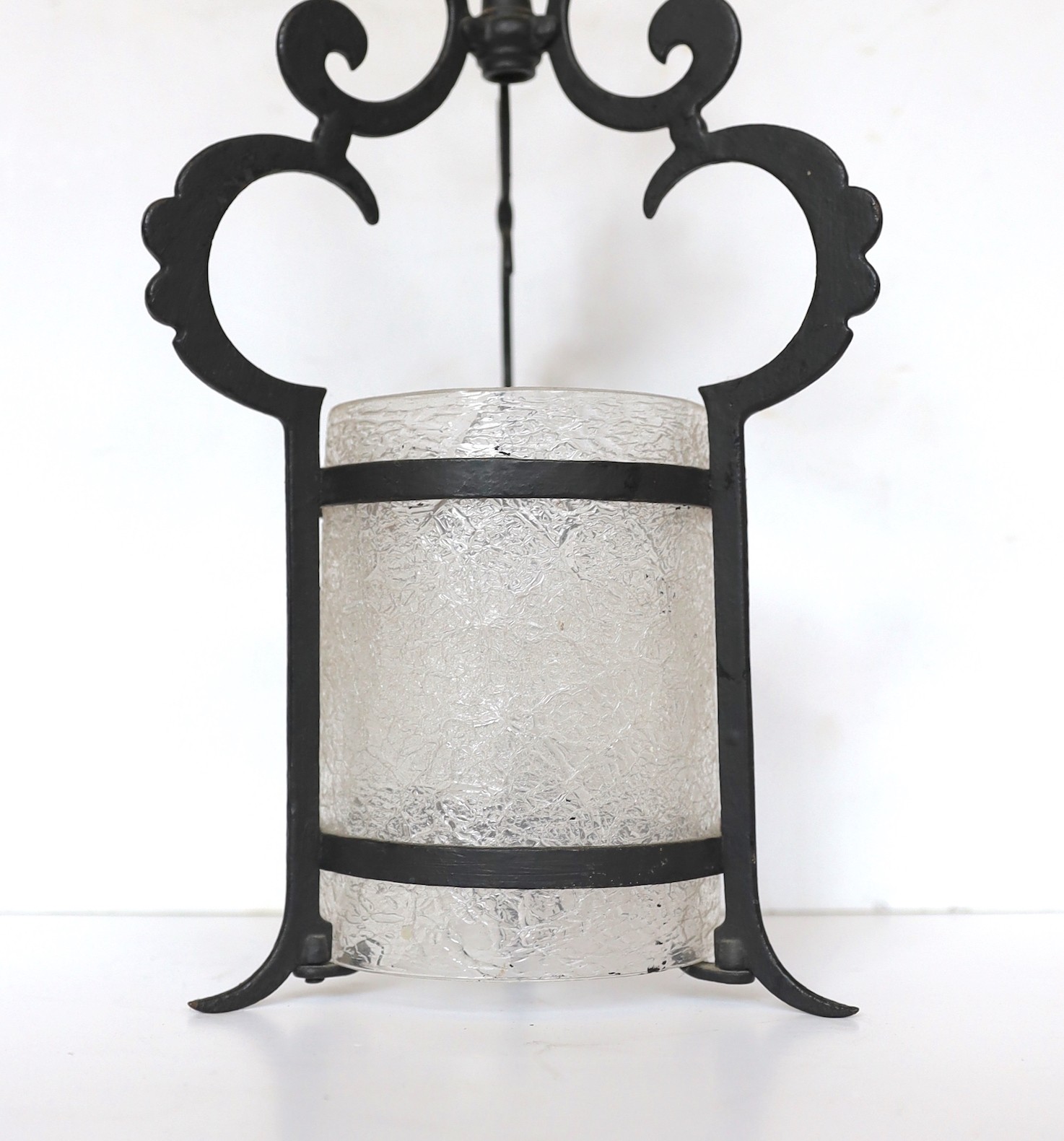 An early 20th century English wrought iron hall lantern with frosted glass liner, height 40cm to 40cm